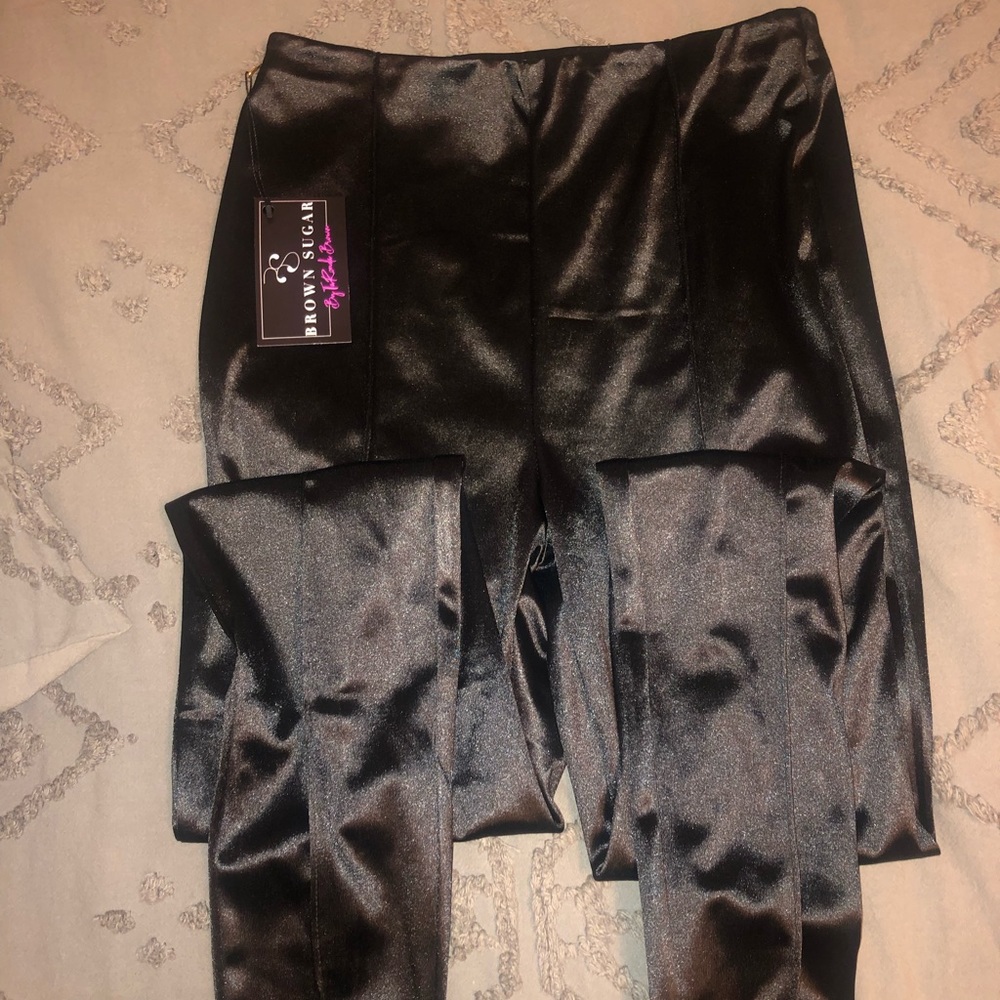 Black, fake leather pants. Never worn.